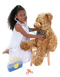 Adorable Little Playing Doctor To A Teddy Bear Over White Stock Photos