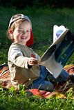 The kid studies to read Stock Photo