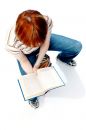 Young girl read the book on white Royalty Free Stock Photos