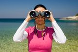 GIRL WITH BINOCULARS Royalty Free Stock Image