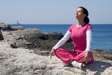 YOGA ON THE ROCK Stock Image