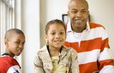 Girl and family - girl sharp Stock Photography