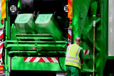 Garbage truck and worker Stock Image