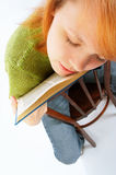 Young girl read the book on white Royalty Free Stock Photo