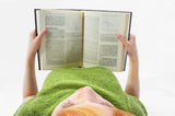 Young girl read the book on white Royalty Free Stock Photo