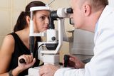 Male ophthalmologist conducting an eye examination Stock Image
