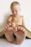 Child read a book Stock Photos