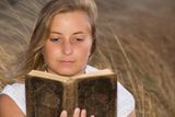 Woman with a book Stock Images