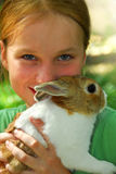 Girl with a bunny Stock Images