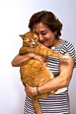 Lady holding cat Stock Images