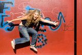 Trendy teenager jumping Royalty Free Stock Images