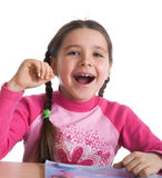 Fun girl with textbook Royalty Free Stock Photos