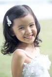 Pretty lass in flower girl attire Royalty Free Stock Photos
