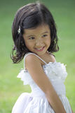Pretty lass in flower girl attire Royalty Free Stock Photos