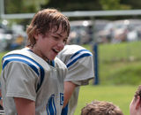 Teen Youth Football Talking with Teammates Royalty Free Stock Photos