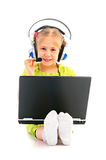 Girlie in headphones with laptop Stock Photography