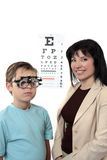 Optometstrist givine eye examination Stock Image
