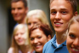Line of smiling youth faces looking happy Royalty Free Stock Photos