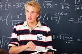 Education - Male teacher teaching mathematics Stock Images