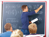 Education - Male teacher teaching algebra Royalty Free Stock Photography