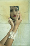 Young lady with mirror Royalty Free Stock Images