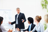 Business man giving training to his colleagues Royalty Free Stock Images