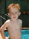 Redheaded boy hands on hips Stock Photography