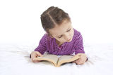 Young girl reading book isolated Royalty Free Stock Images
