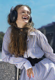 Face of girl with head-phones Royalty Free Stock Photo
