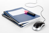 Blue school textbook and computer mouse Stock Photo