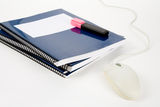 Blue school textbook and computer mouse Stock Photography