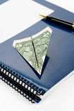 Blue school textbook and dollar Royalty Free Stock Photos