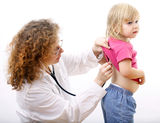 Woman doctor studies little girl Stock Photography