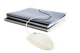 Blue school textbook and computer mouse Royalty Free Stock Photography