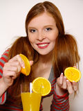 Redheaded  girl with orange Stock Photo