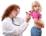 Woman doctor studies little girl Royalty Free Stock Photo