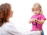 Little girl studies  female doctor Royalty Free Stock Image