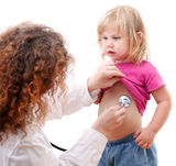 Woman doctor studies small young girl Royalty Free Stock Photos