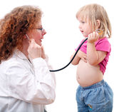 Woman doctor studies little girl Royalty Free Stock Photography