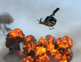 Helicopter over fire Royalty Free Stock Photo