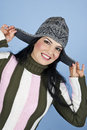 Smiling happy woman with winter cap Stock Photo