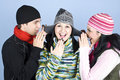 Friends telling secrets and laughing Stock Images