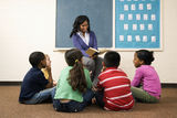 Teacher Reading to Students Stock Photos