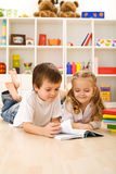Little sister let me show you how to read Royalty Free Stock Image