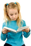 Young girl is reading a book Stock Photos
