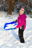 Girlie in snow Stock Images