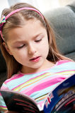 Girl reading English book Royalty Free Stock Photography