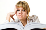 Beautiful young girl with a book on white Stock Photography