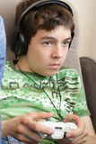 Teenager with game pad Stock Photo