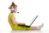 Girlie in headphones with laptop Royalty Free Stock Photography